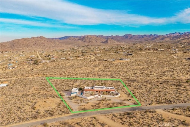7423 Juniper Rd, Joshua Tree, CA 92252 - aerial view of sparsely populated area featuring a mountainous background and property parcel outlined