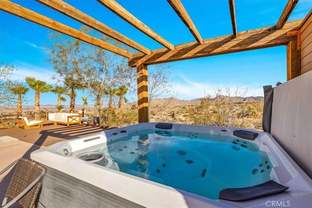 7423 Juniper Rd, Joshua Tree, CA 92252 - view of patio / terrace featuring a hot tub and a mountain view