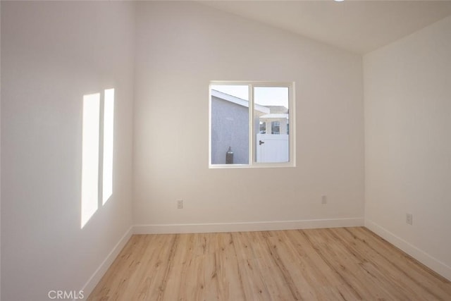 1402 E Luray St, Long Beach, CA 90807 - spare room featuring light wood finished floors and vaulted ceiling