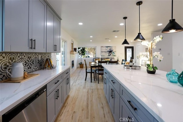 1402 E Luray St, Long Beach, CA 90807 - kitchen with stainless steel dishwasher, gray cabinetry, recessed lighting, light wood-type flooring, and light stone counters
