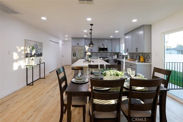 1402 E Luray St, Long Beach, CA 90807 - dining room with light wood-style flooring, plenty of natural light, and recessed lighting