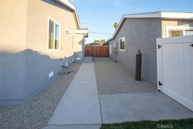 1402 E Luray St, Long Beach, CA 90807 - view of home's exterior with stucco siding and a gate
