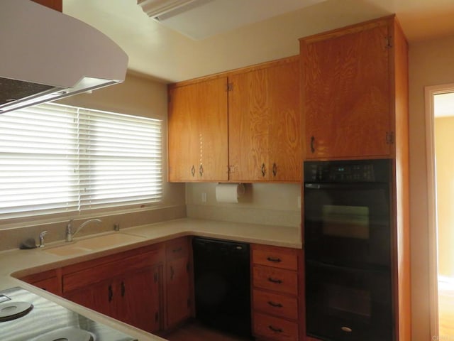 5629 Pray Ct, Bonita, CA 91902 - kitchen featuring black appliances, light countertops, extractor fan, and brown cabinetry
