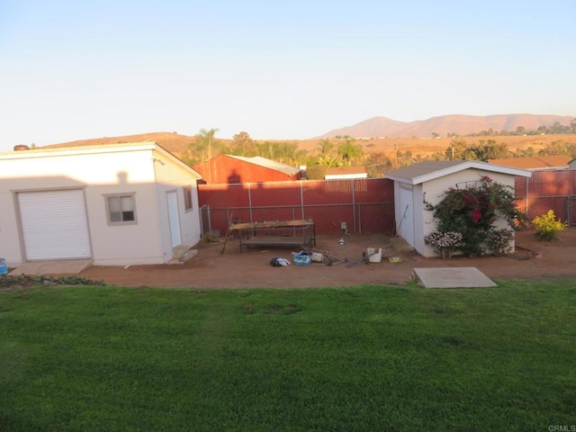 5629 Pray Ct, Bonita, CA 91902 - fenced backyard featuring a mountain view and a storage unit
