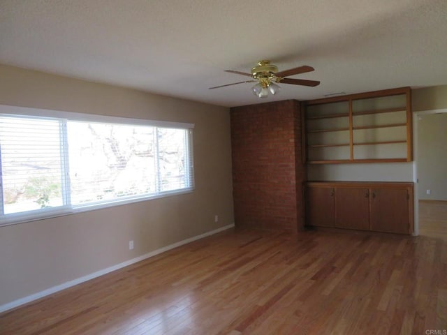 5629 Pray Ct, Bonita, CA 91902 - empty room with a ceiling fan, light wood-type flooring, and a textured ceiling
