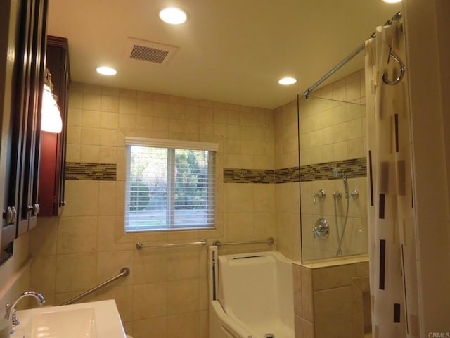 5629 Pray Ct, Bonita, CA 91902 - full bathroom with a shower, tile walls, recessed lighting, a tub, and vanity