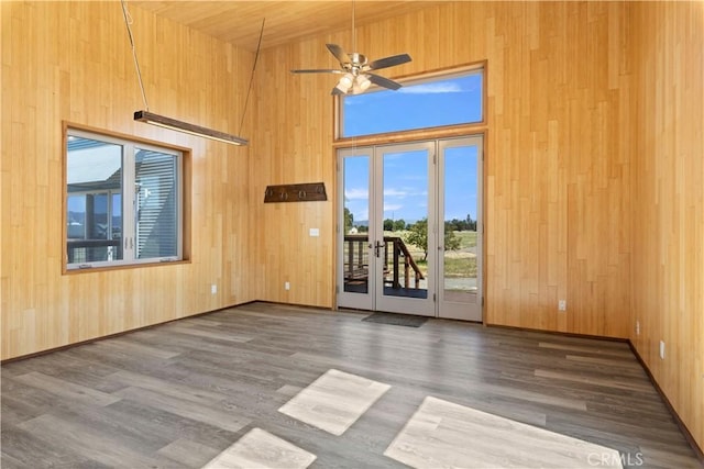 3155 Soda Bay Rd, Lakeport, CA 95453 - spare room featuring wood walls, wood finished floors, a ceiling fan, and french doors