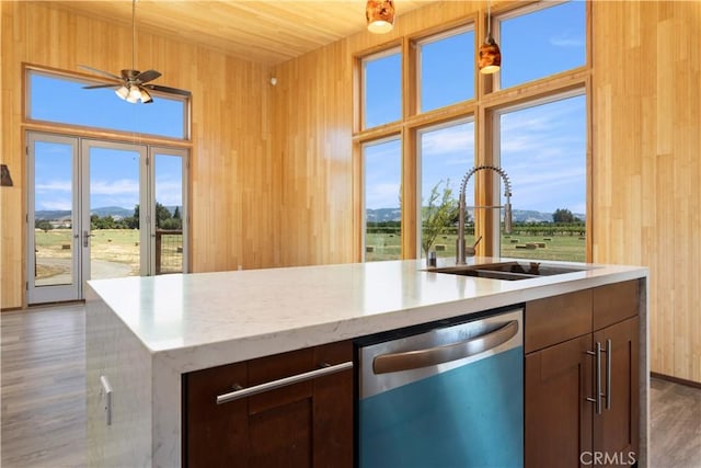 3155 Soda Bay Rd, Lakeport, CA 95453 - kitchen featuring dishwasher, a mountain view, a ceiling fan, dark wood-style flooring, and plenty of natural light