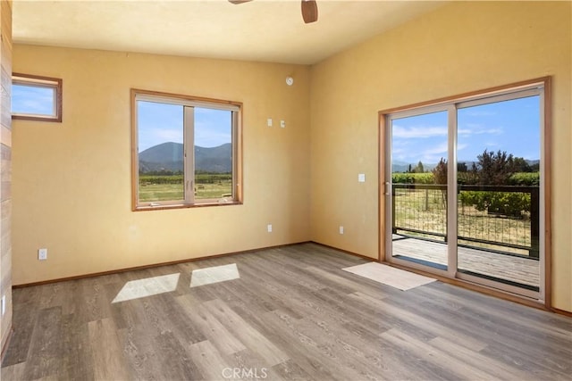 3155 Soda Bay Rd, Lakeport, CA 95453 - unfurnished room featuring ceiling fan, wood finished floors, and a mountain view
