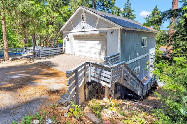 810 Oakmont Ln, Lake Arrowhead, CA 92352 - view of side of property with a garage, stairs, an outbuilding, and a wooden deck