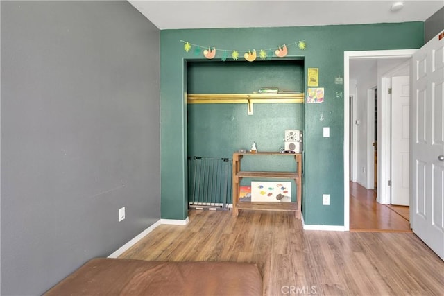 810 Oakmont Ln, Lake Arrowhead, CA 92352 - unfurnished bedroom with radiator, wood finished floors, and a closet
