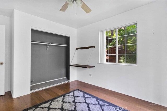 810 Oakmont Ln, Lake Arrowhead, CA 92352 - unfurnished bedroom with wood finished floors, a closet, and ceiling fan