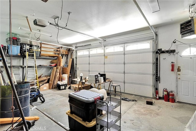 810 Oakmont Ln, Lake Arrowhead, CA 92352 - garage featuring a heating unit and a garage door opener