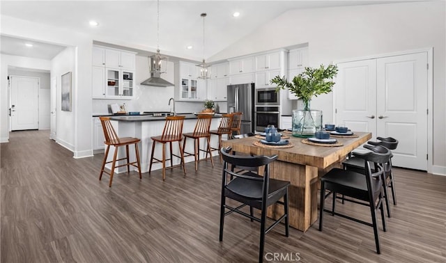 233 Carmelita Ln, Tehachapi, CA 93561 - dining area with lofted ceiling, dark wood-type flooring, and recessed lighting