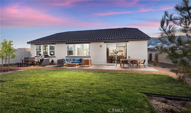 233 Carmelita Ln, Tehachapi, CA 93561 - rear view of house with an outdoor hangout area, a tile roof, stucco siding, and a patio