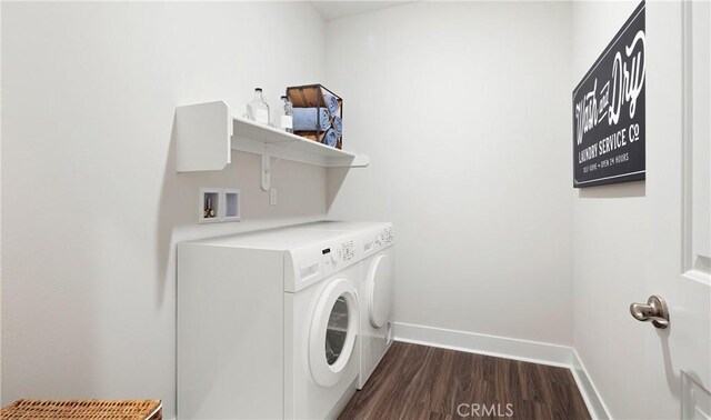 233 Carmelita Ln, Tehachapi, CA 93561 - washroom with washer and clothes dryer and dark wood-type flooring