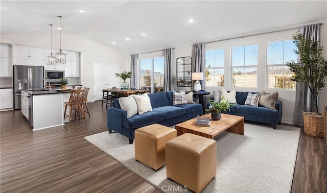 233 Carmelita Ln, Tehachapi, CA 93561 - living room featuring dark wood-style floors, recessed lighting, and high vaulted ceiling