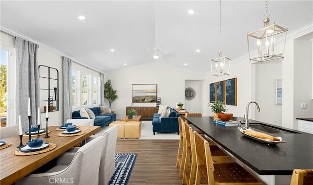 233 Carmelita Ln, Tehachapi, CA 93561 - living area with dark wood-style flooring, vaulted ceiling, ceiling fan, recessed lighting, and crown molding