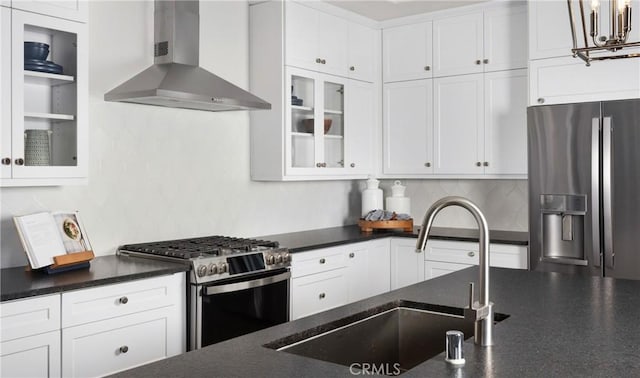 233 Carmelita Ln, Tehachapi, CA 93561 - kitchen with wall chimney exhaust hood, stainless steel appliances, backsplash, and white cabinetry