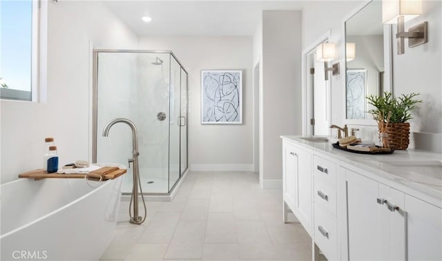 233 Carmelita Ln, Tehachapi, CA 93561 - bathroom with a shower stall, double vanity, a soaking tub, tile patterned flooring, and recessed lighting