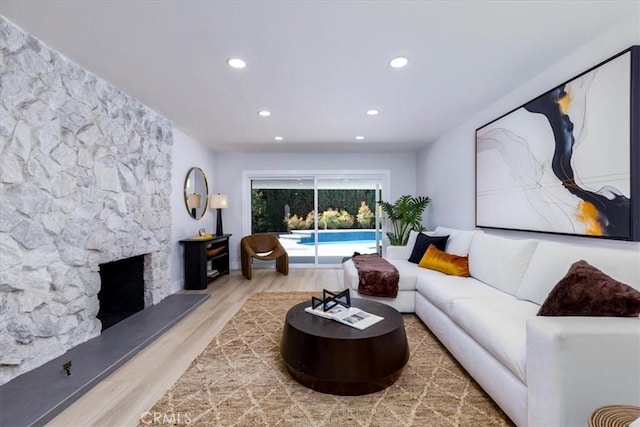 19625 Romar St, Northridge, CA 91324 - living area featuring wood finished floors, recessed lighting, and a stone fireplace