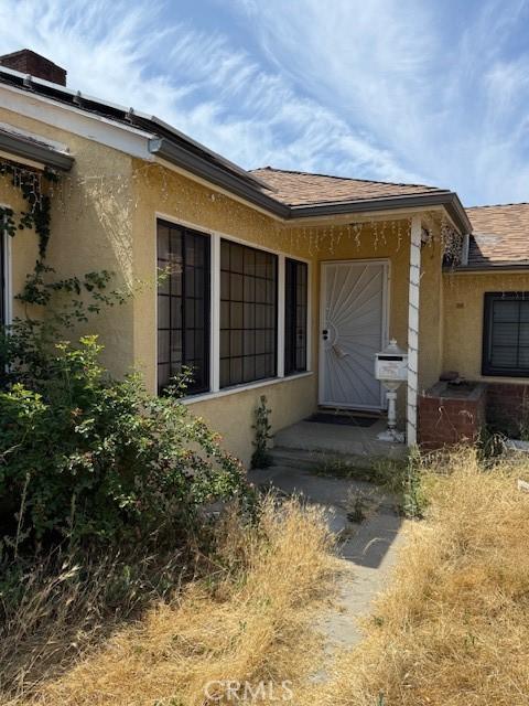 14594 Dyer St, Sylmar, CA 91342 - view of exterior entry featuring stucco siding