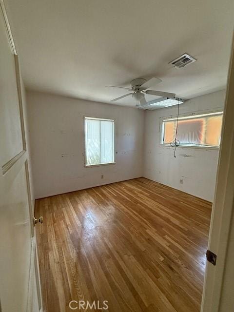 14594 Dyer St, Sylmar, CA 91342 - unfurnished bedroom with wood finished floors and a ceiling fan
