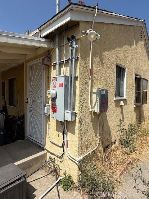 14594 Dyer St, Sylmar, CA 91342 - view of side of home featuring stucco siding