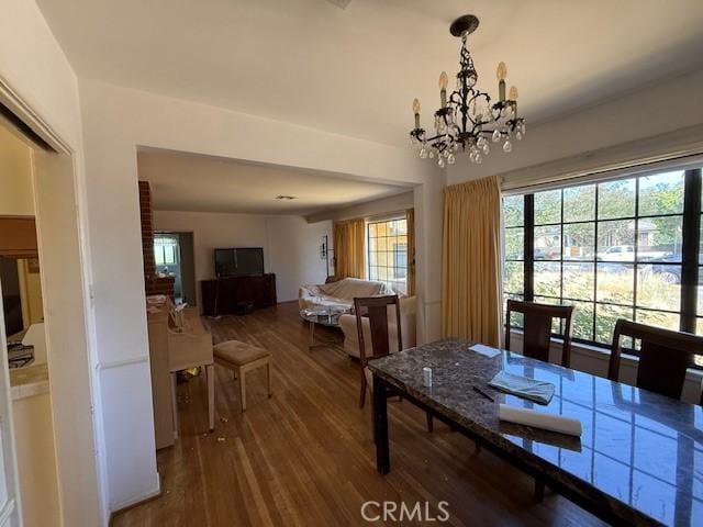 14594 Dyer St, Sylmar, CA 91342 - dining area with wood finished floors and a chandelier