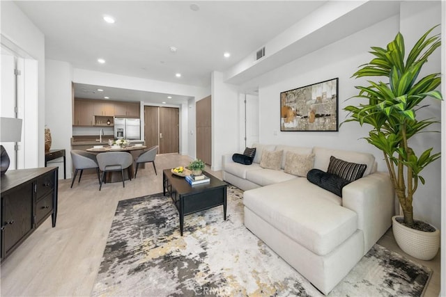 168 S Monterey St Unit 502, Alhambra, CA 91801 - living room with light wood-style floors and recessed lighting