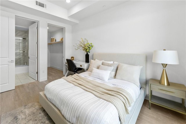 168 S Monterey St Unit 502, Alhambra, CA 91801 - bedroom with wood finished floors, a spacious closet, a closet, recessed lighting, and ensuite bath