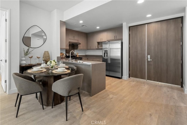168 S Monterey St Unit 502, Alhambra, CA 91801 - kitchen with stainless steel appliances, a peninsula, light wood-style flooring, and recessed lighting