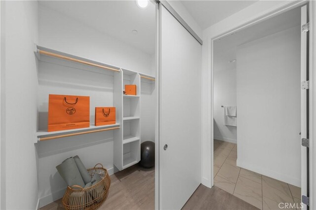 168 S Monterey St Unit 502, Alhambra, CA 91801 - walk in closet featuring marble look tiles