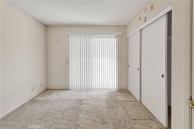 16205 Tokay St, Victorville, CA 92395 - unfurnished bedroom featuring carpet flooring, a closet, and a textured ceiling