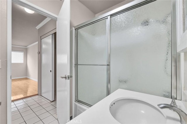 532 N Rossmore Ave Unit 411, Los Angeles, CA 90004 - full bathroom featuring ornamental molding, a shower with shower door, and tile patterned floors