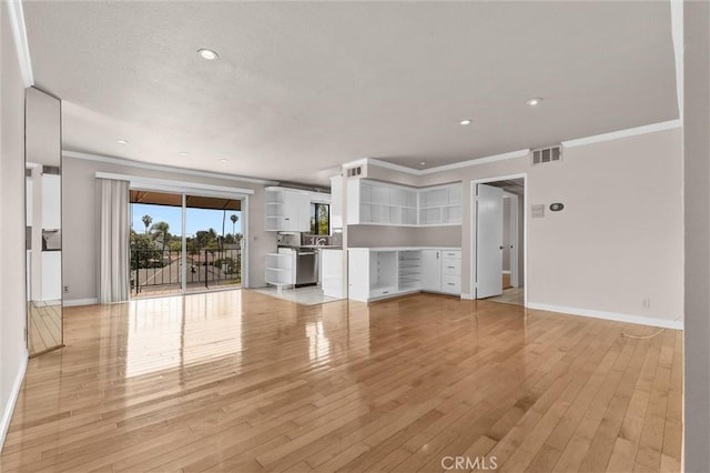 532 N Rossmore Ave Unit 411, Los Angeles, CA 90004 - unfurnished living room with crown molding, light wood-type flooring, and recessed lighting