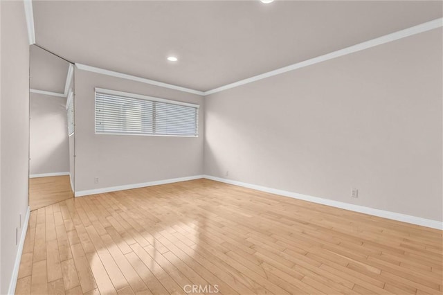 532 N Rossmore Ave Unit 411, Los Angeles, CA 90004 - spare room featuring light wood-type flooring, crown molding, and recessed lighting