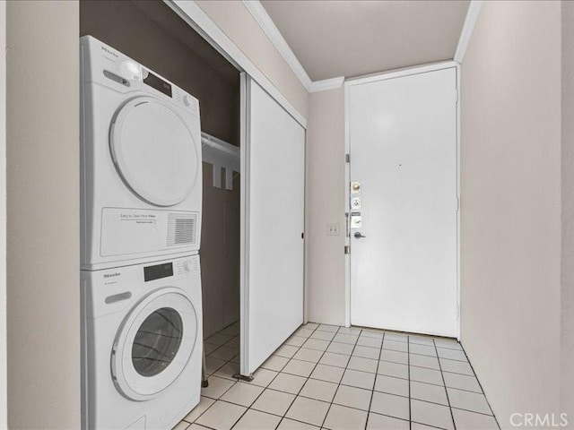 532 N Rossmore Ave Unit 411, Los Angeles, CA 90004 - washroom with stacked washing machine and dryer, crown molding, and light tile patterned floors