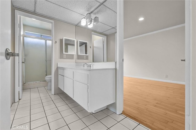 532 N Rossmore Ave Unit 411, Los Angeles, CA 90004 - full bath with vanity, a stall shower, tile patterned flooring, and a drop ceiling