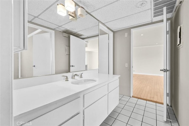 532 N Rossmore Ave Unit 411, Los Angeles, CA 90004 - bathroom featuring vanity, tile patterned flooring, and a paneled ceiling