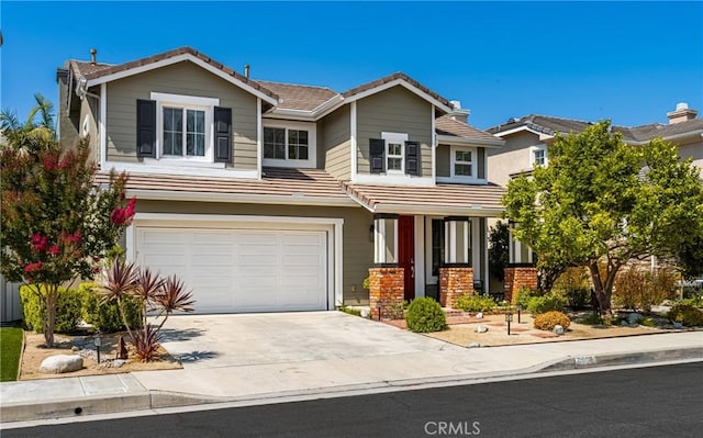 8507 E Heatherview Ln, Orange, CA 92869 - view of front of property with a tile roof, driveway, a garage, and a porch