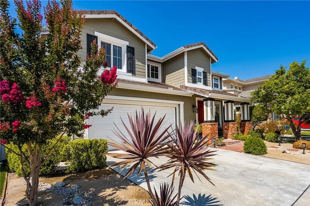 8507 E Heatherview Ln, Orange, CA 92869 - view of front facade featuring an attached garage, driveway, and a tile roof