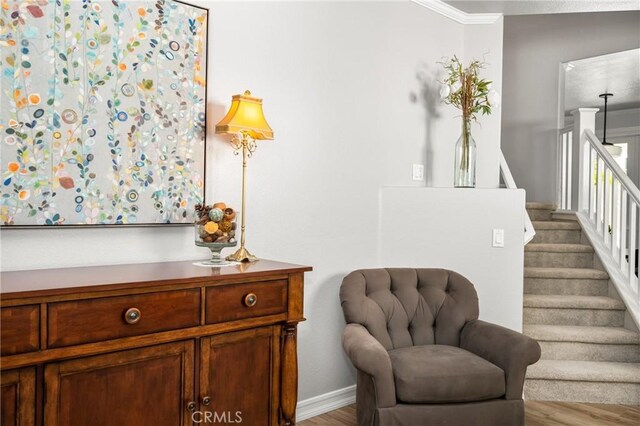 8507 E Heatherview Ln, Orange, CA 92869 - living area with wood finished floors, stairway, and crown molding
