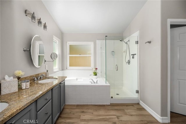 8507 E Heatherview Ln, Orange, CA 92869 - full bath featuring a stall shower, a bath, wood finished floors, and double vanity