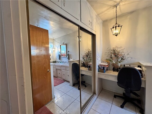 2064 E Campus Way, Hemet, CA 92544 - office area featuring a chandelier, built in desk, and light tile patterned floors