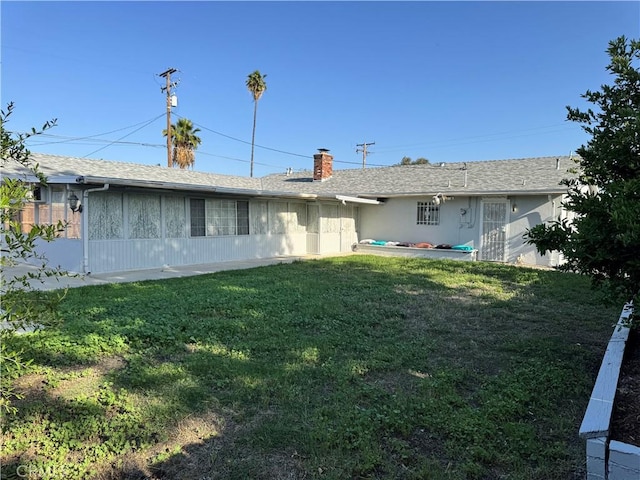 2064 E Campus Way, Hemet, CA 92544 - back of house featuring a yard and a chimney