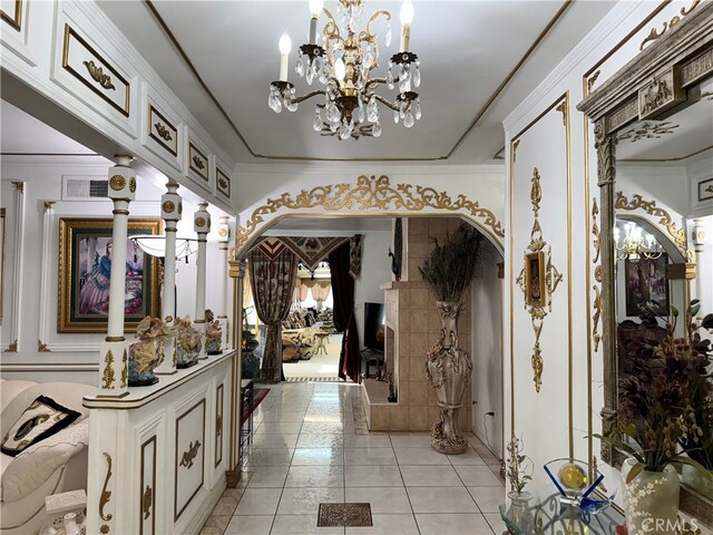 2064 E Campus Way, Hemet, CA 92544 - entrance foyer with arched walkways, a chandelier, and light tile patterned floors