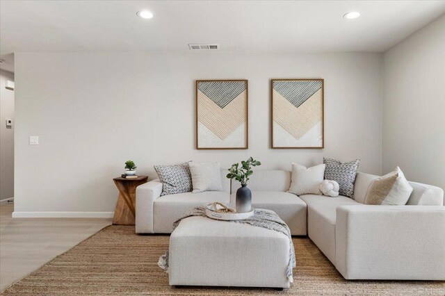 7911 Terraza Disoma, Carlsbad, CA 92009 - living area with light wood-style floors and recessed lighting