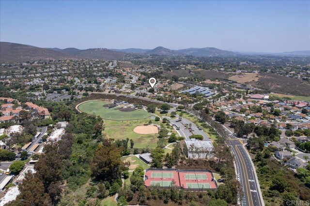 7911 Terraza Disoma, Carlsbad, CA 92009 - aerial overview of property's location with a mountainous background and nearby suburban area