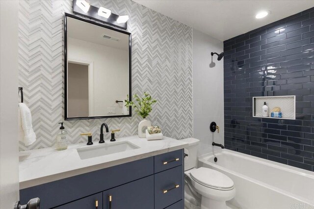 7911 Terraza Disoma, Carlsbad, CA 92009 - bathroom with vanity, tub / shower combination, and decorative backsplash
